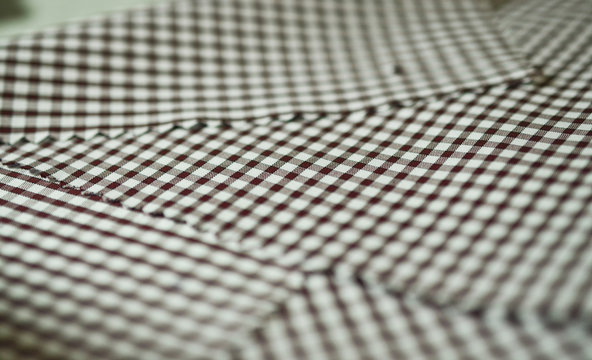 close up texture brown scott pattern fabric of shirt