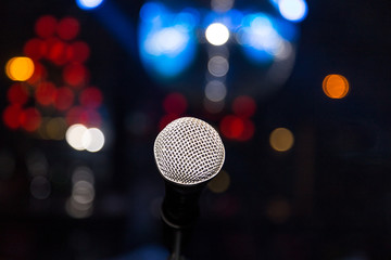 microphone in club on background of a bright lights