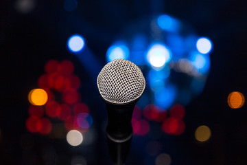 microphone in club on background of a bright lights