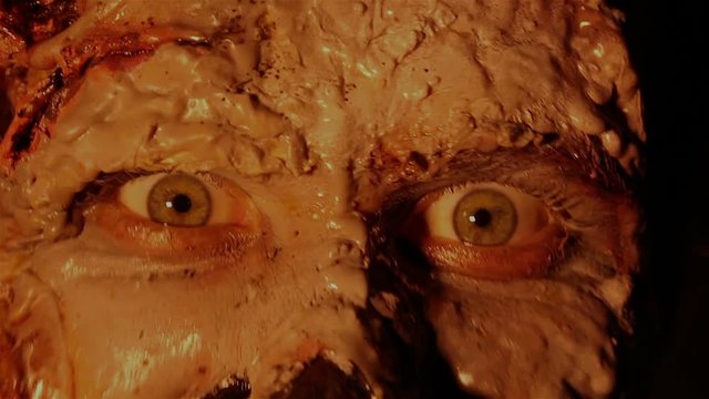 scary zombie monster looking at the camera