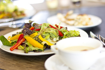 Lunch at the hotel. A fresh vegetable salad. Business lunch. The hotel is five stars. Main dishes. Salad on the table

