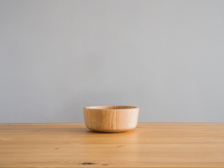 Wooden bowl on table.