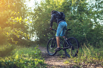 Mountain biker rides a Bicycle in the morning