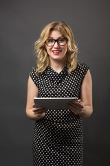 Student woman in glasses with tablet pc studying