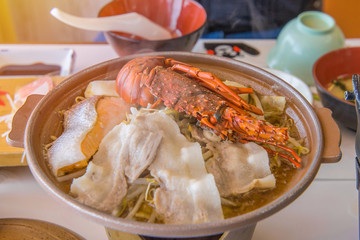 Japanese seafood hot pot with beef and shrimp or lobster