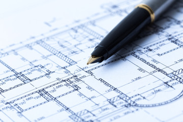 Pen and architectural blueprints