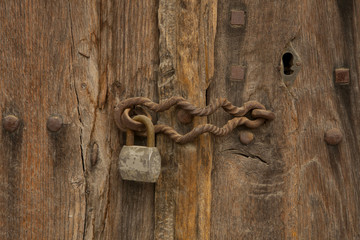 padlock on an old wooden door