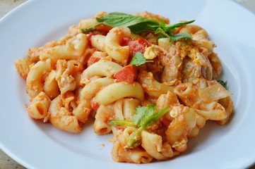 stir fried macaroni and egg with pork in ketchup on plate