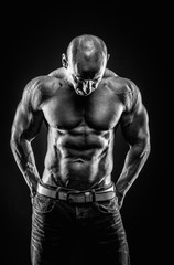 Fototapeta na wymiar very muscular handsome athletic man on black background