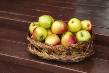 Apples in a wicker basket. Selective focus