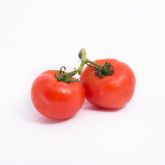 Isolated image of ripe tomatoes  on a white background