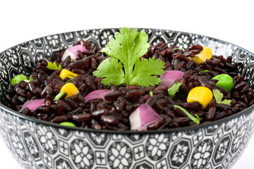 Black rice and vegetables isolated on white background

