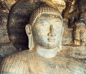 Fototapeta na wymiar Buddha statue carved in to the rock