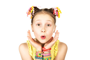 Surprised girl with a fashionable hairstyle with trendy handmade weaving bracelets on a white background