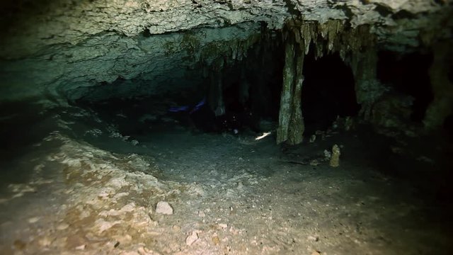 Underwater stalactites and stalagmites in landscape Mexican Sacred Mayan Cenote. Deep underground clean and clear fresh lake in cave. Unique shooting Wonders of Yucatan Peninsula nature in Dos Ojos.