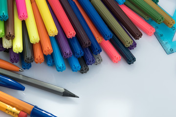 colored markers on the white background