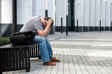 Sad headache middle age man portrait outdoors