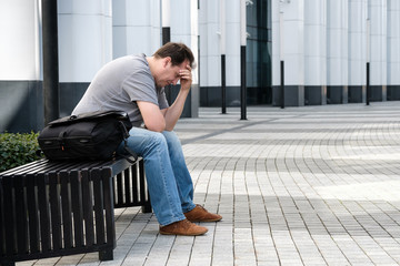 Sad headache middle age man portrait outdoors