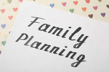 Paper sheet with words Family planning, close up