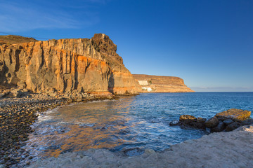 Coastline of Gran Canaria island at sunset, Spain