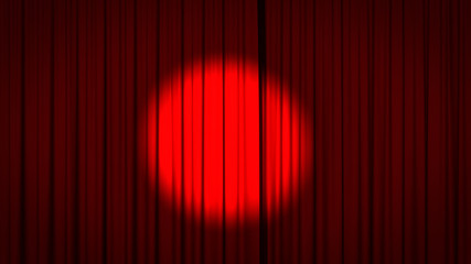 Red stage curtain with a spotlight in the center.