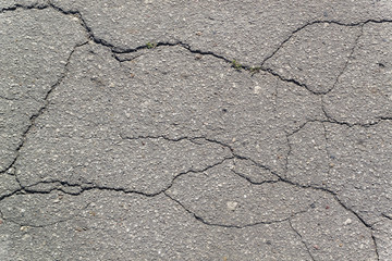 Obraz premium Texture of the old road with cracks