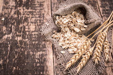 oat flakes on wooden table.healthy food concept.