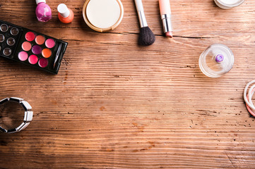 Obraz na płótnie Canvas Various make-up products laid on table. Copy space