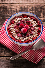 Breakfast banana smoothie bowl topped with goji berries,raspberry