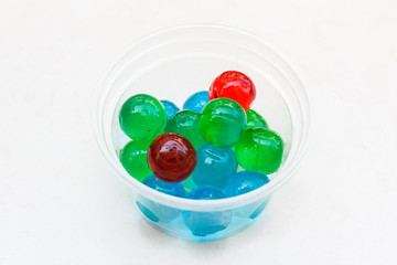 Jelly ball in plastic cup.