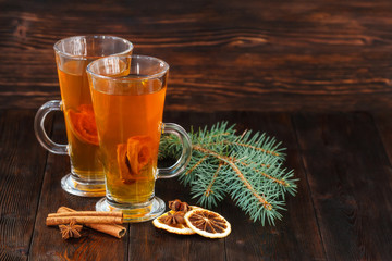 Compote of dried fruits with ingridients on dark rustic wooden background