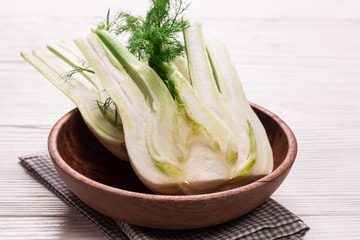 Fresh organic fennel on wooden dark table