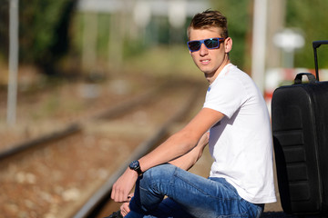 The young man at the railway station.
