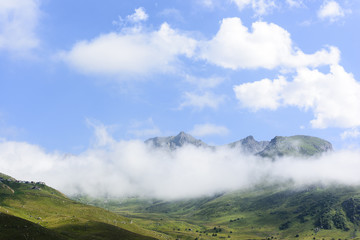 Fototapeta na wymiar beautiful traditional plateau life and green nature on the mountains with fog