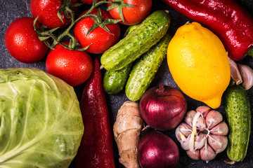 Assortment of fresh vegetables close up on black table