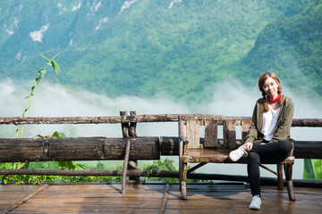 Smiling young woman With  Montains Background ( Chiang Mai ,Thailand)