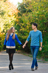 Falling in love autumn. walking couple