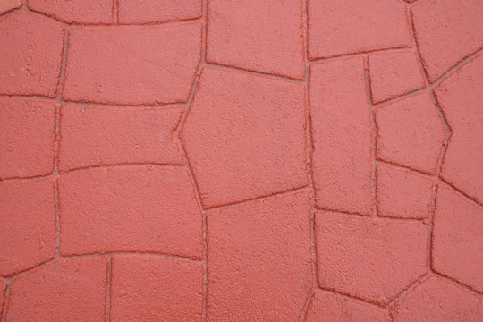Red stamp concrete texture pattern and background.