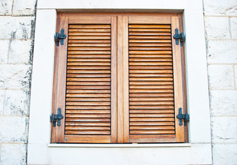 Window with closed shutters in the house