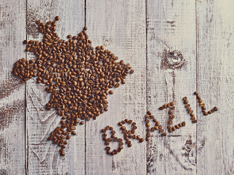 Map of Brazil country made out of coffee beans on wooden background