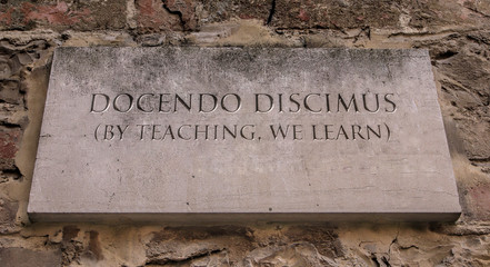 Docendo discimus. A Latin phrase meaning By teaching, we learn. Johnson State College motto.