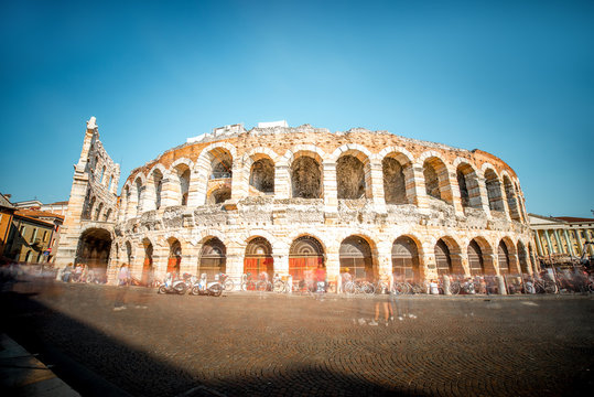 Roman amphitheatre on Bra square in Verona city in Italy. Long exposure image technic with blurred people