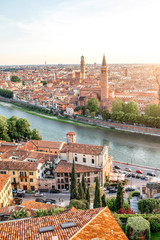 Fototapeta na wymiar Panoramic aerial view on Verona old town from the castle hill on the sunset
