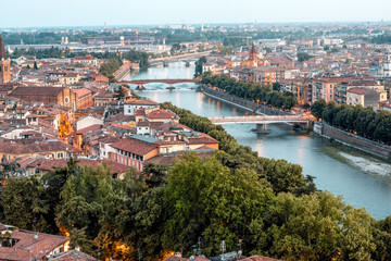 Fototapeta na wymiar Aerial view on Adige river with bridges in Verona city in Italy