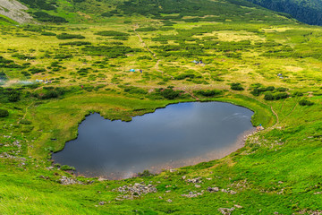 Carpathian mountains landscape, view from the height, Nesamovyte lake under hill.