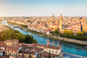Fototapeta na wymiar Panoramic aerial view on Verona old town from the castle hill on the sunrise