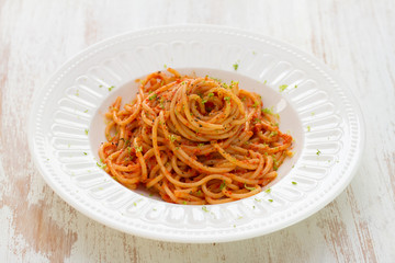 spaghetti with sauce on white plate