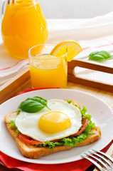 Fototapeta premium Breakfast of toast with orange juice