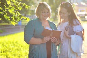 woman senior in park with book