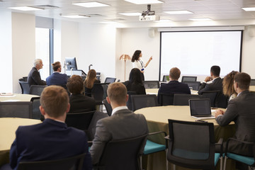 Businesswoman Making Presentation At Conference